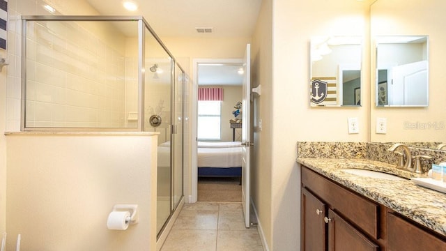 1450 Rolling Fairway Dr, Davenport, FL 33896 - full bathroom featuring a shower stall, vanity, tile patterned flooring, and ensuite bathroom