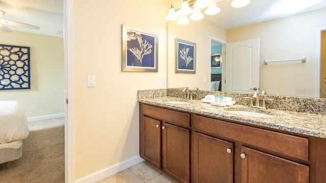 1450 Rolling Fairway Dr, Davenport, FL 33896 - bathroom with a ceiling fan, double vanity, baseboards, and tile patterned floors