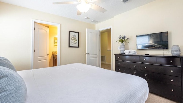 1450 Rolling Fairway Dr, Davenport, FL 33896 - bedroom featuring light colored carpet, connected bathroom, and ceiling fan