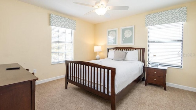 1450 Rolling Fairway Dr, Davenport, FL 33896 - bedroom featuring light carpet, baseboards, and a ceiling fan
