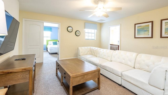 1450 Rolling Fairway Dr, Davenport, FL 33896 - carpeted living area featuring ceiling fan and baseboards