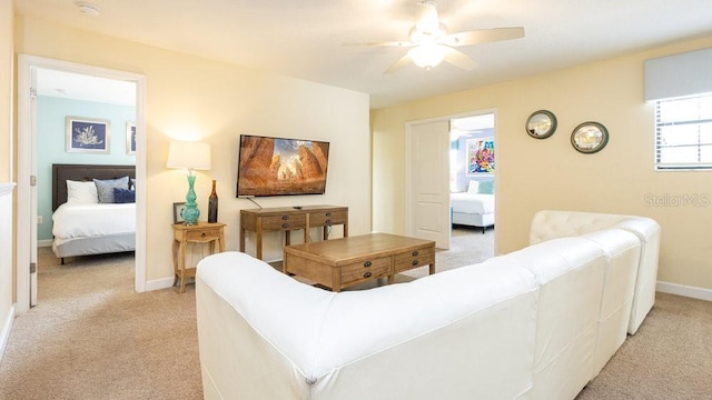 1450 Rolling Fairway Dr, Davenport, FL 33896 - living area with light carpet, ceiling fan, and baseboards