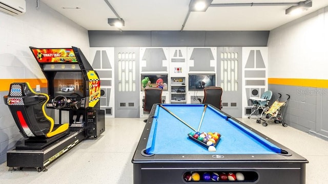 1450 Rolling Fairway Dr, Davenport, FL 33896 - rec room with a wall mounted AC and concrete block wall