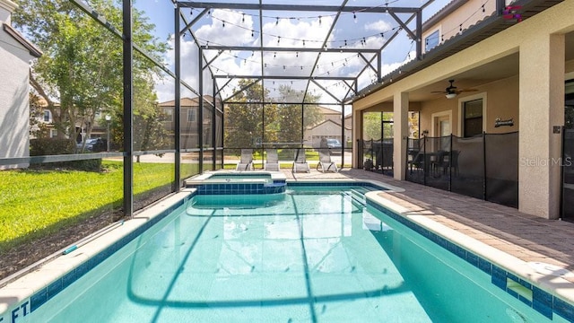 1450 Rolling Fairway Dr, Davenport, FL 33896 - view of pool featuring a pool with connected hot tub, a lanai, a patio, a lawn, and a ceiling fan