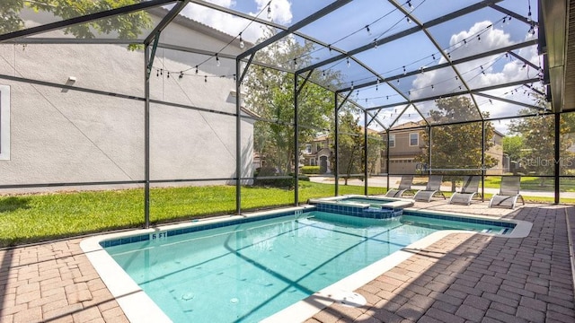 1450 Rolling Fairway Dr, Davenport, FL 33896 - view of swimming pool featuring glass enclosure, a patio, and a pool with connected hot tub
