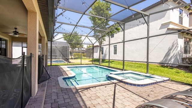 1450 Rolling Fairway Dr, Davenport, FL 33896 - view of swimming pool featuring a patio, a lanai, a pool with connected hot tub, and ceiling fan