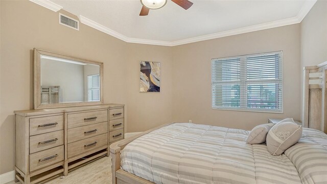 bedroom featuring ornamental molding and a ceiling fan