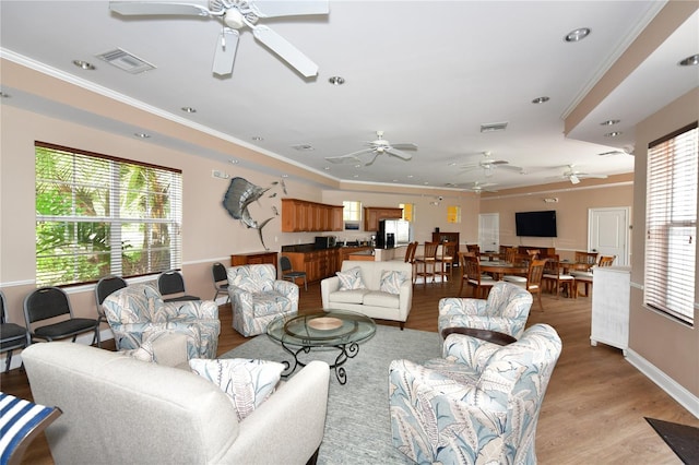 610 Riviera Dunes Way Unit 308, Palmetto, FL 34221 - living area featuring ceiling fan, light wood-type flooring, ornamental molding, baseboards, and recessed lighting