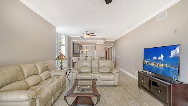 610 Riviera Dunes Way Unit 308, Palmetto, FL 34221 - living area with ceiling fan, ornamental molding, baseboards, and light wood-style floors