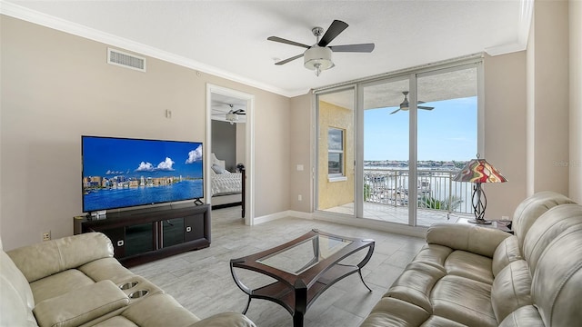 610 Riviera Dunes Way Unit 308, Palmetto, FL 34221 - living room with floor to ceiling windows, ceiling fan, ornamental molding, and baseboards