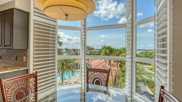 610 Riviera Dunes Way Unit 308, Palmetto, FL 34221 - unfurnished sunroom featuring plenty of natural light and expansive windows