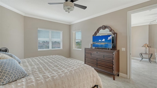 610 Riviera Dunes Way Unit 308, Palmetto, FL 34221 - bedroom with crown molding, baseboards, and a ceiling fan