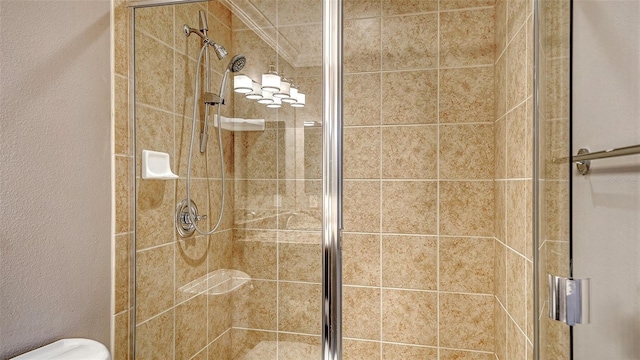 610 Riviera Dunes Way Unit 308, Palmetto, FL 34221 - bathroom featuring a shower stall and toilet