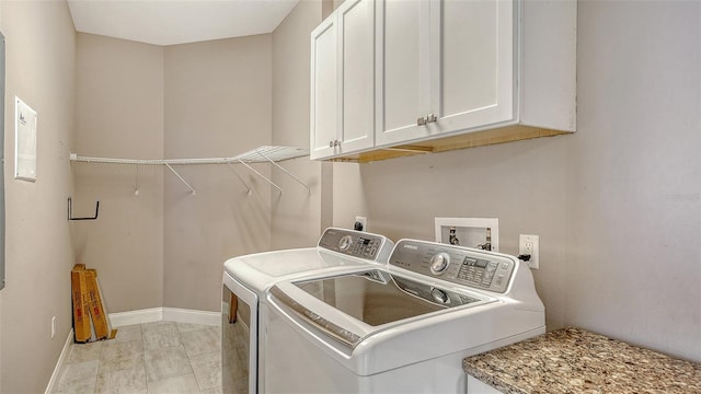 610 Riviera Dunes Way Unit 308, Palmetto, FL 34221 - washroom featuring cabinet space, independent washer and dryer, and baseboards