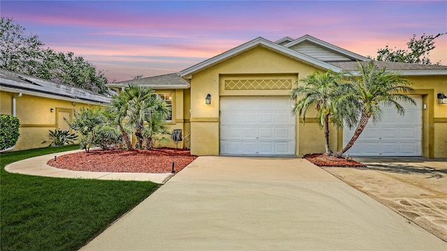 203 28th St W, Palmetto, FL 34221 - single story home with stucco siding, driveway, and an attached garage