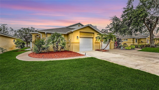 203 28th St W, Palmetto, FL 34221 - ranch-style house with stucco siding, concrete driveway, an attached garage, a lawn, and roof with shingles