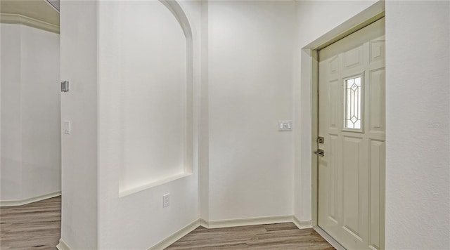 203 28th St W, Palmetto, FL 34221 - foyer entrance featuring wood finished floors, arched walkways, and baseboards