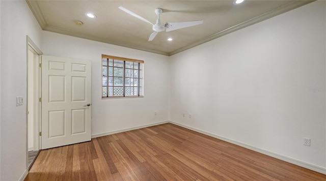 203 28th St W, Palmetto, FL 34221 - empty room featuring wood finished floors, crown molding, ceiling fan, baseboards, and recessed lighting