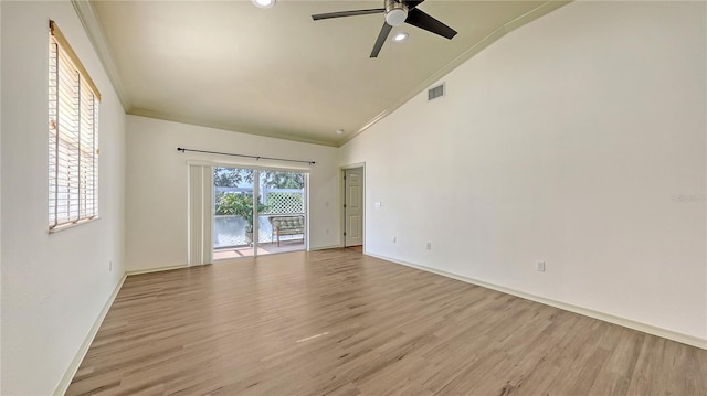 203 28th St W, Palmetto, FL 34221 - spare room with light wood-style flooring, a ceiling fan, baseboards, crown molding, and high vaulted ceiling