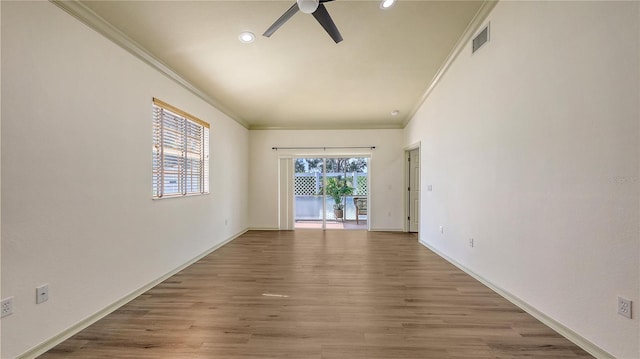 203 28th St W, Palmetto, FL 34221 - spare room with ceiling fan, ornamental molding, recessed lighting, wood finished floors, and baseboards