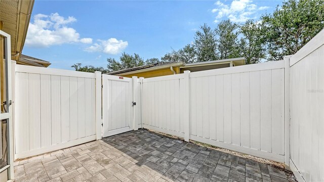 203 28th St W, Palmetto, FL 34221 - view of patio with a gate and fence