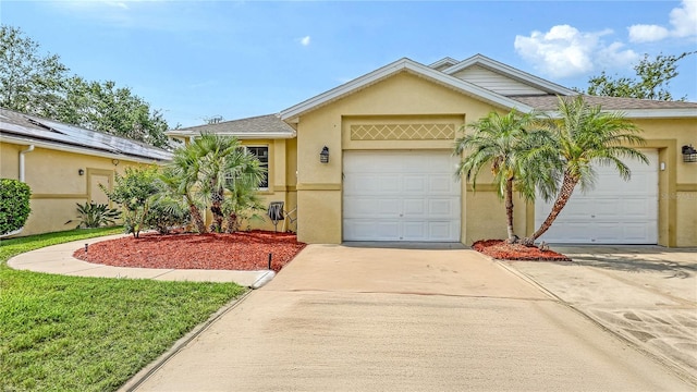 203 28th St W, Palmetto, FL 34221 - ranch-style home featuring stucco siding, driveway, and an attached garage
