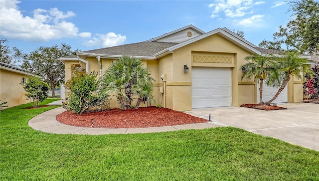 203 28th St W, Palmetto, FL 34221 - view of front facade featuring stucco siding, driveway, a front yard, an attached garage, and a shingled roof