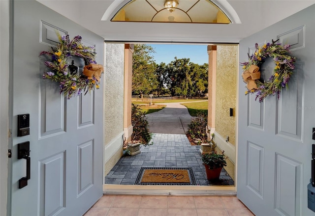entrance foyer featuring light tile patterned floors