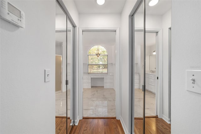 hall with wood finished floors