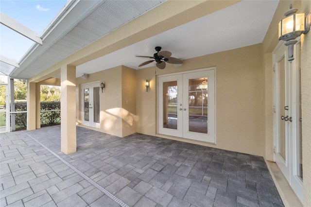 view of patio / terrace with french doors, a ceiling fan, and a lanai