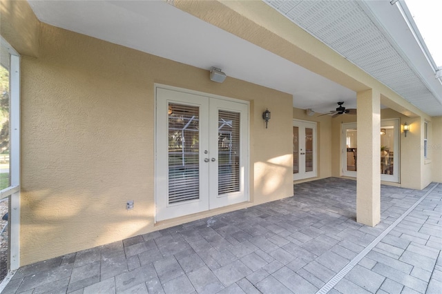 view of patio with french doors and a ceiling fan