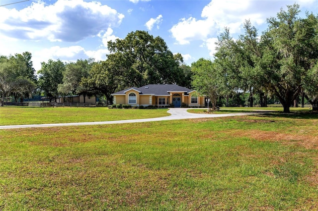 ranch-style home with curved driveway