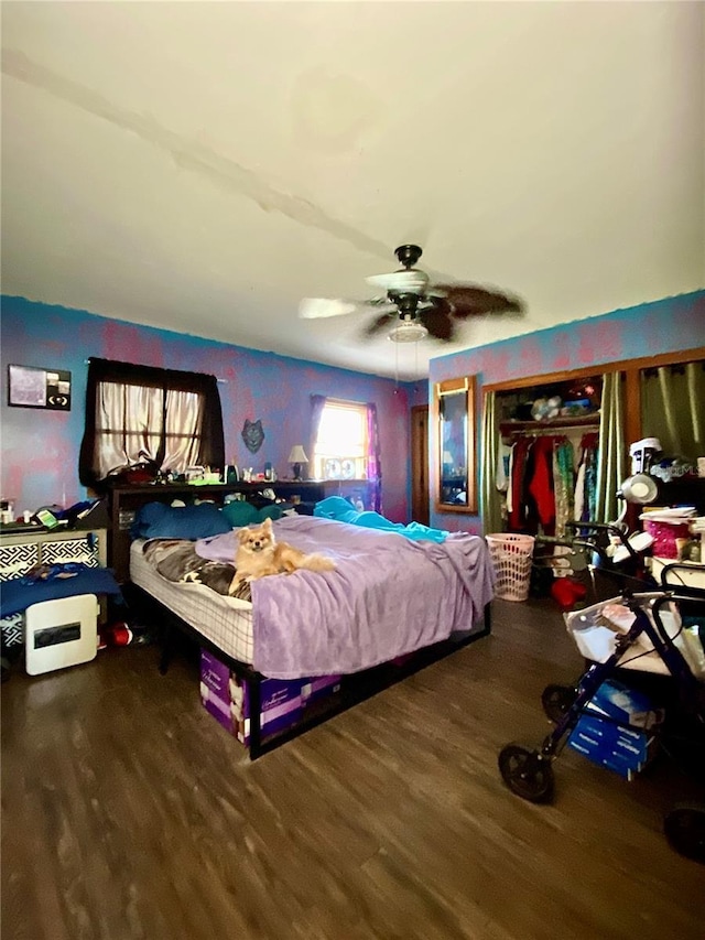 bedroom with wood finished floors and a ceiling fan