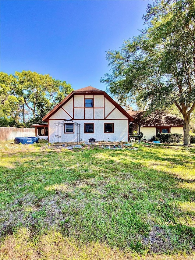rear view of property with stucco siding