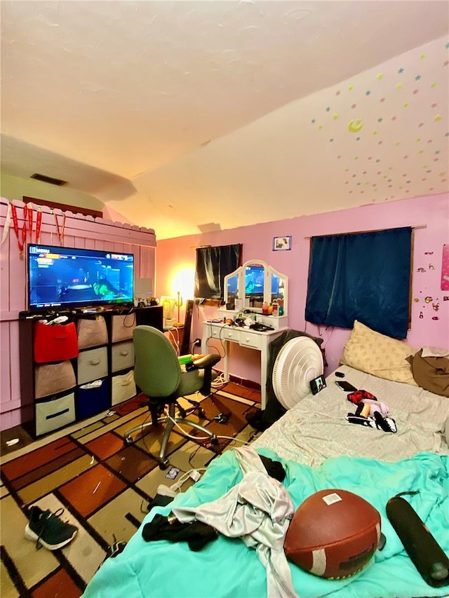 bedroom with lofted ceiling