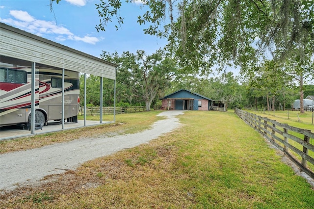 140 Cowpen Ln, Sarasota, FL 34240 - view of yard with driveway and a carport