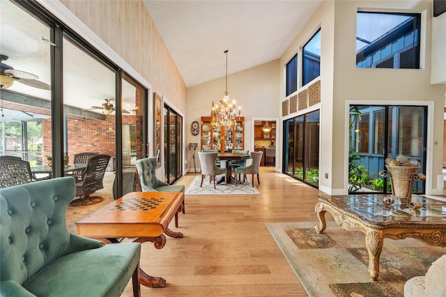 140 Cowpen Ln, Sarasota, FL 34240 - sunroom featuring healthy amount of natural light, vaulted ceiling, and a chandelier