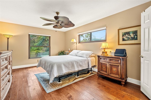 140 Cowpen Ln, Sarasota, FL 34240 - bedroom featuring hardwood / wood-style floors, baseboards, and ceiling fan