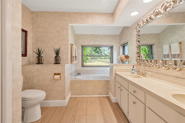 140 Cowpen Ln, Sarasota, FL 34240 - full bathroom with toilet, a garden tub, and double vanity
