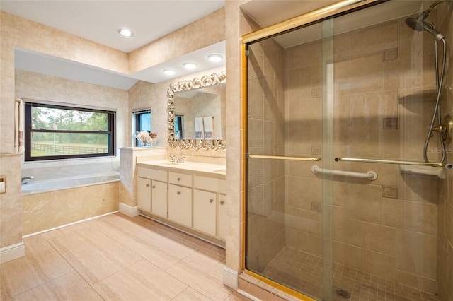 140 Cowpen Ln, Sarasota, FL 34240 - bathroom featuring a stall shower, vanity, a bath, tile patterned flooring, and recessed lighting