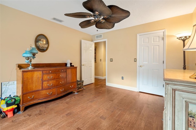 140 Cowpen Ln, Sarasota, FL 34240 - bedroom with wood finished floors, baseboards, and a ceiling fan