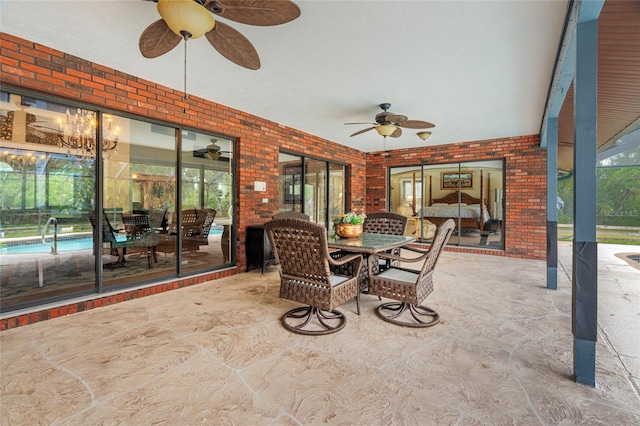 140 Cowpen Ln, Sarasota, FL 34240 - view of patio / terrace with a ceiling fan, outdoor dining space, an outdoor pool, and glass enclosure