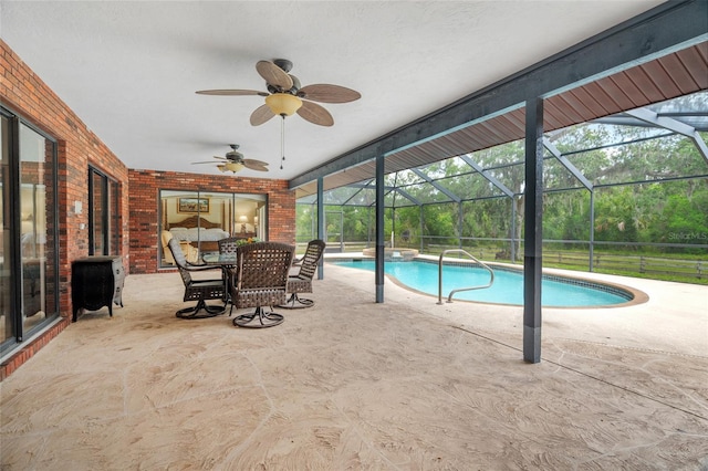 140 Cowpen Ln, Sarasota, FL 34240 - swimming pool featuring a patio area, glass enclosure, and a ceiling fan