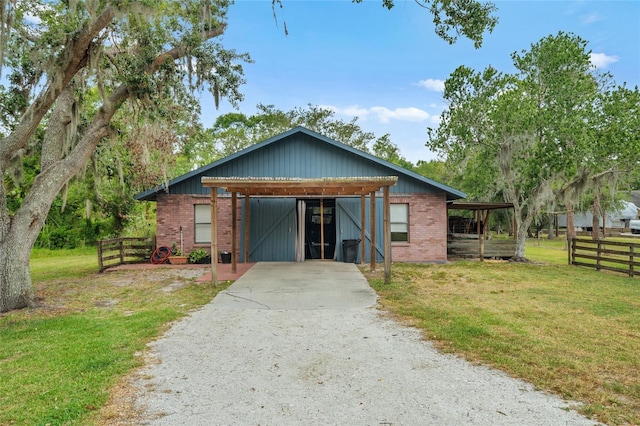 140 Cowpen Ln, Sarasota, FL 34240 - view of front of home featuring concrete driveway, brick siding, and a carport