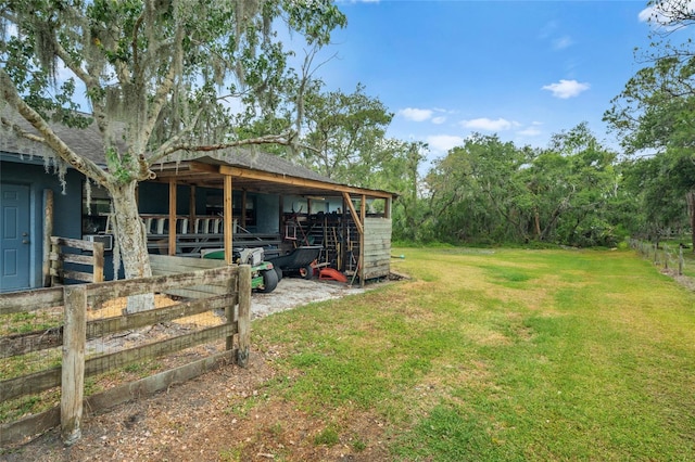 140 Cowpen Ln, Sarasota, FL 34240 - view of yard with an outdoor structure and an exterior structure