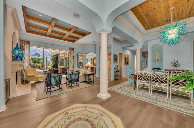 community lobby with crown molding, coffered ceiling, and beamed ceiling