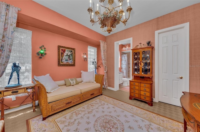 living area with a chandelier and carpet floors
