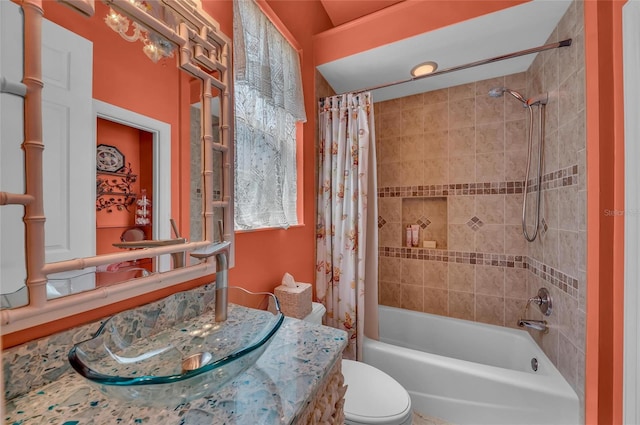 bathroom with shower / tub combo, toilet, and vanity