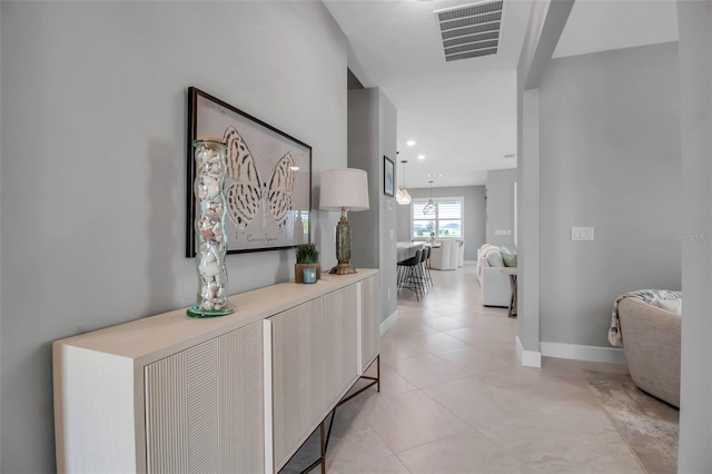 10414 Spring Tide Way, Parrish, FL 34219 - hall with light tile patterned flooring and baseboards