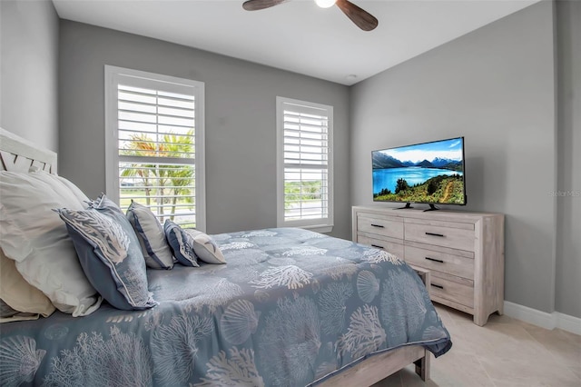 10414 Spring Tide Way, Parrish, FL 34219 - bedroom featuring ceiling fan, baseboards, and light tile patterned floors